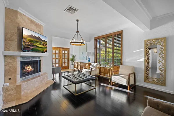 a view of room with window and wooden floor