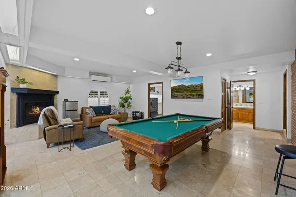 a view of a house with swimming pool and sitting area