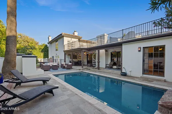 a patio with patio a fireplace and a fireplace