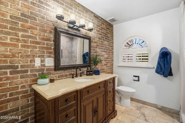 a bed room with a bed and a chandelier