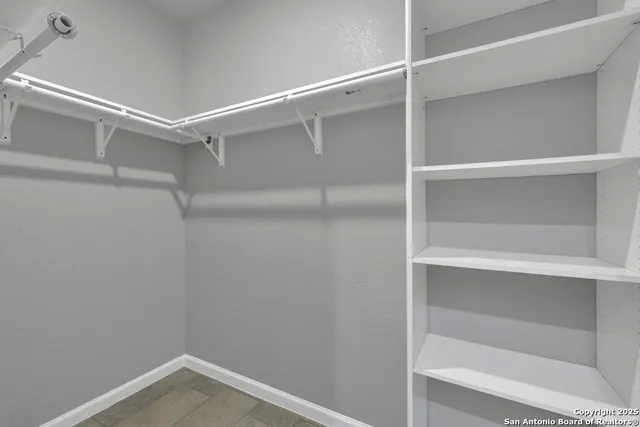 a view of an empty walk in closet