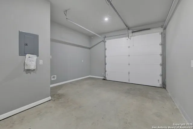 a view of furniture and refrigerator in a room