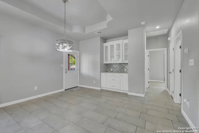 a view of an empty room and window