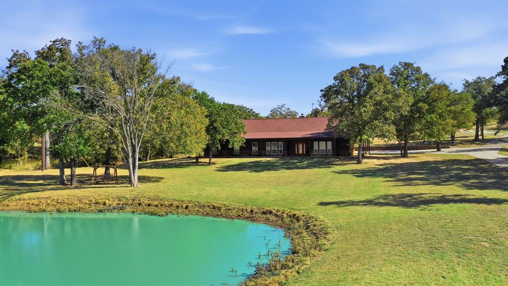 160 Falcon Drive Weatherford, TX 76088 - Photo 2 of 40 a swimming pool with outdoor seating and yard