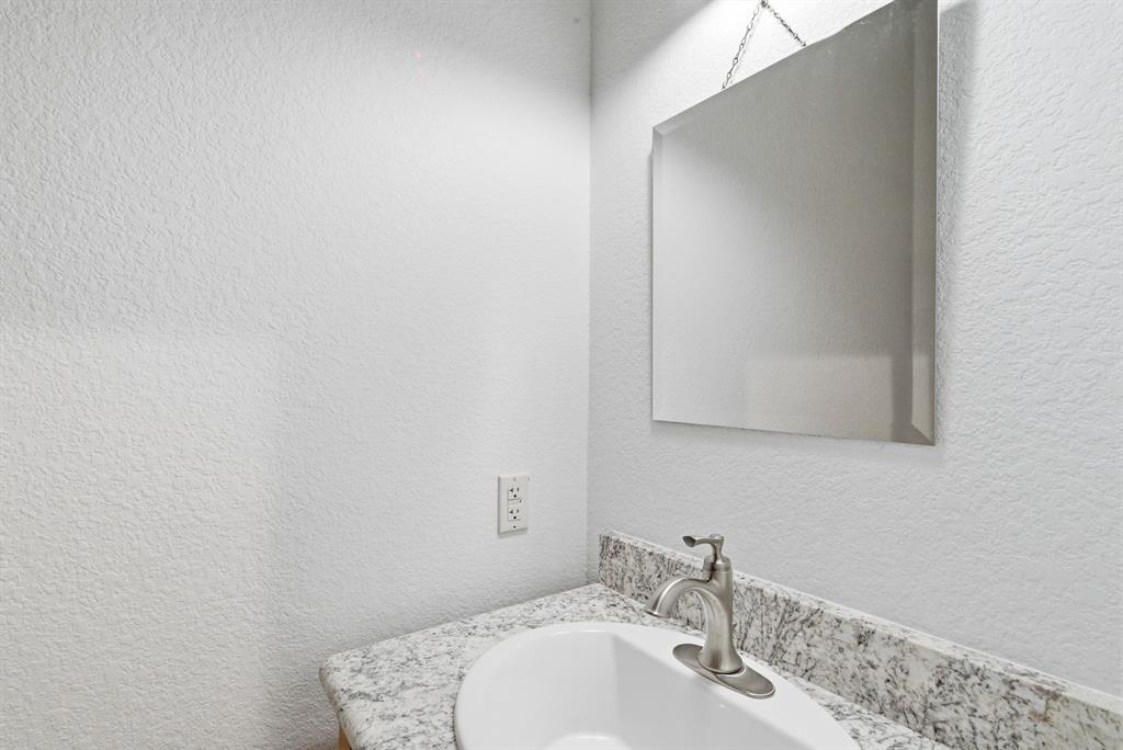 160 Falcon Drive Weatherford, TX 76088 - Photo 26 of 40 a bathroom with a sink and a mirror