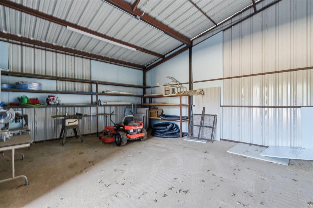 160 Falcon Drive Weatherford, TX 76088 - Photo 38 of 40 a view of a garage with storage