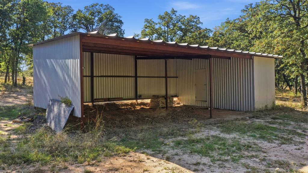 160 Falcon Drive Weatherford, TX 76088 - Photo 39 of 40 a backyard of a house with a small yard and wooden fence