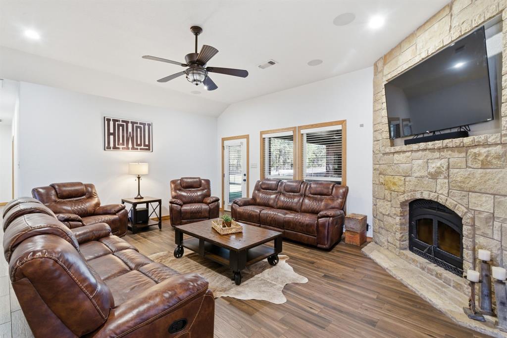 160 Falcon Drive Weatherford, TX 76088 - Photo 7 of 40 a living room with furniture fireplace and flat screen tv
