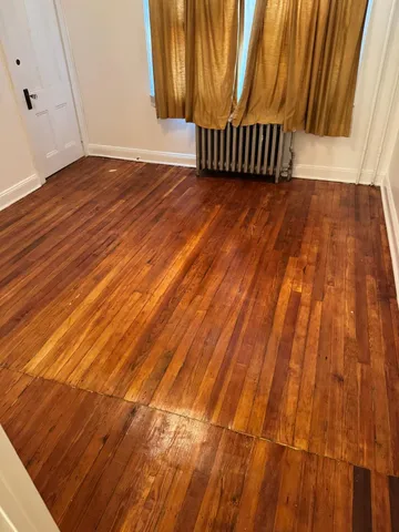 a view of a big room with wooden floor