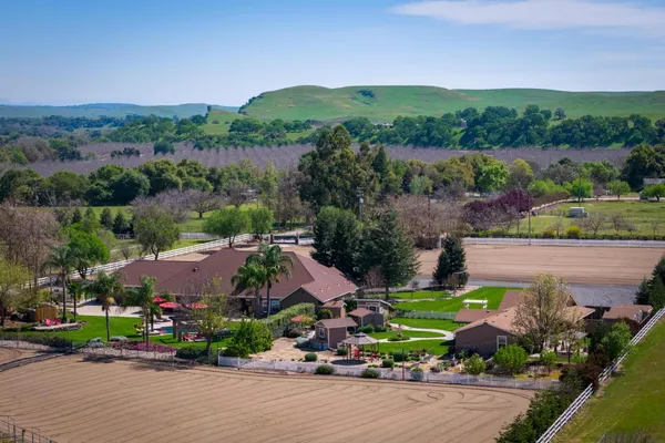 an aerial view of a house with a garden