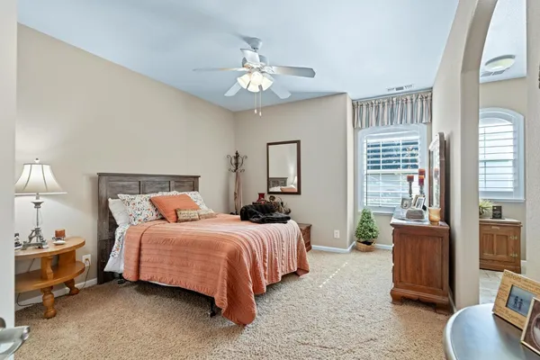 a dining room with furniture window and wooden floor