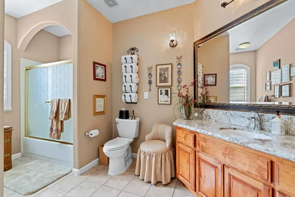 a kitchen with a sink stove top oven and refrigerator