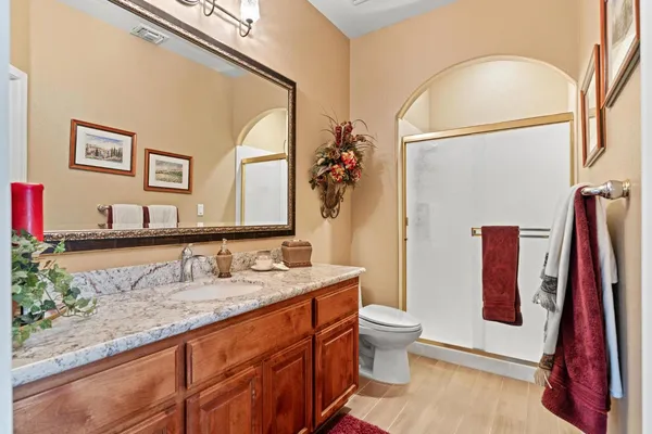 a dining room with furniture a chandelier and window