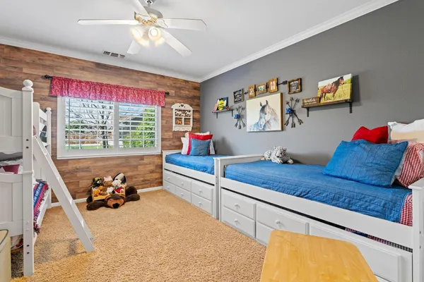 a bedroom with a bed and dresser