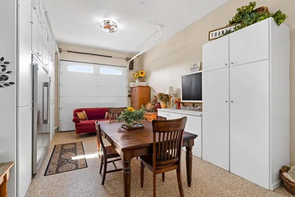 a bathroom with a granite countertop sink mirror vanity and toilet