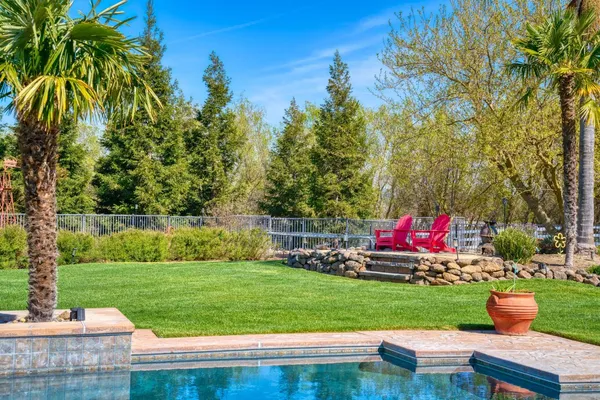 a view of a house with wooden deck