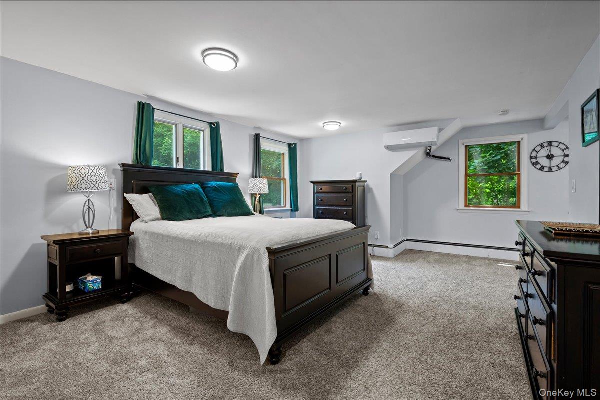 105 High St Extension Mount Kisco, NY 10549 - Photo 30 of 38 a bedroom with a bed and a window