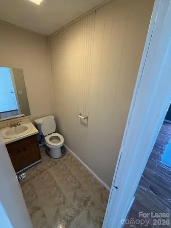 a bathroom with a toilet and a sink
