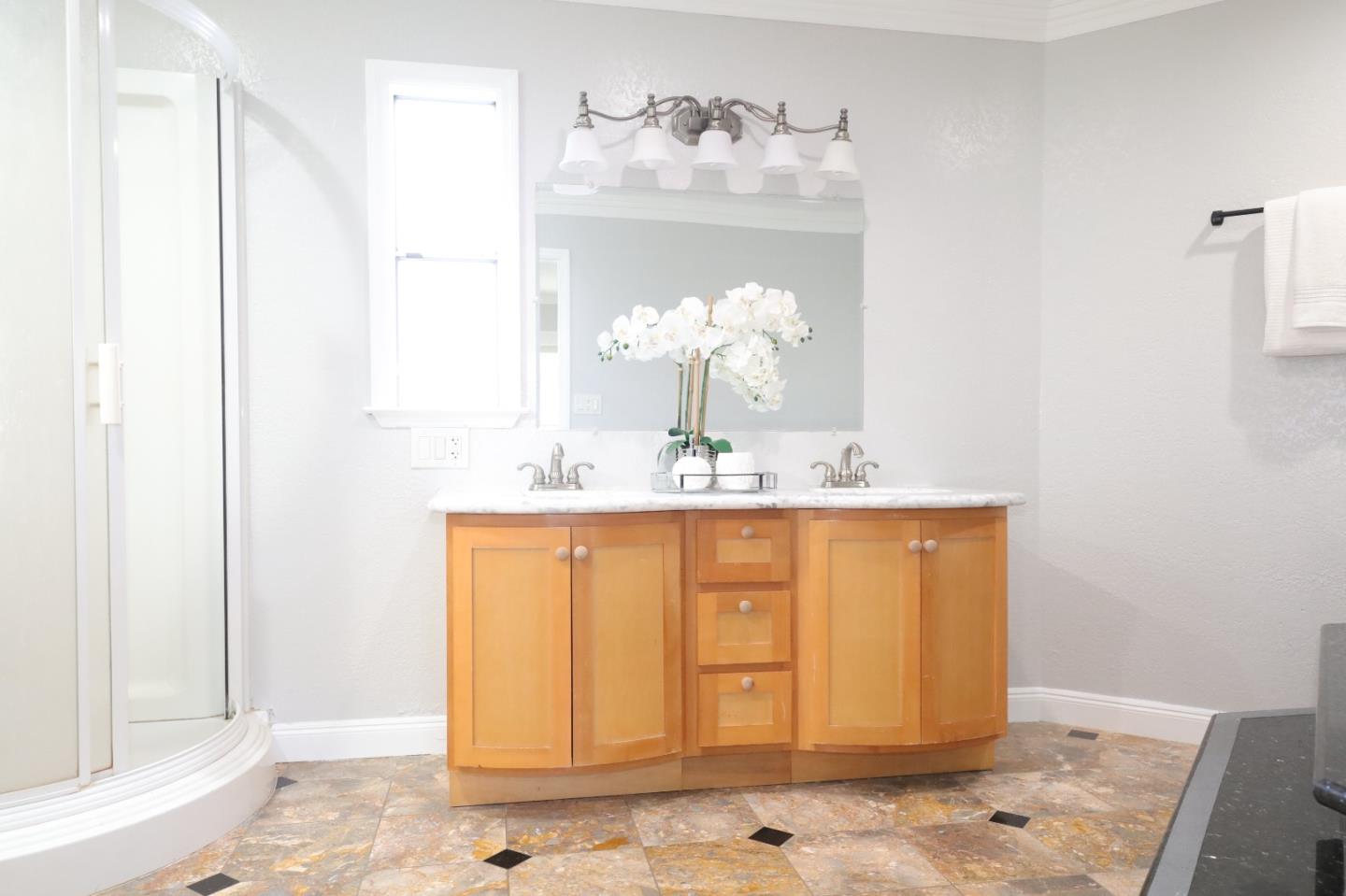 5450 Monterey Road, Unit 168 San Jose, CA 95111 - Photo 11 of 65 a bathroom with a sink a mirror and a window