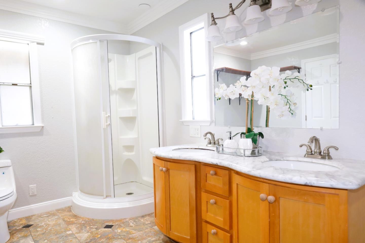 5450 Monterey Road, Unit 168 San Jose, CA 95111 - Photo 17 of 65 a bathroom with a granite countertop sink and a mirror