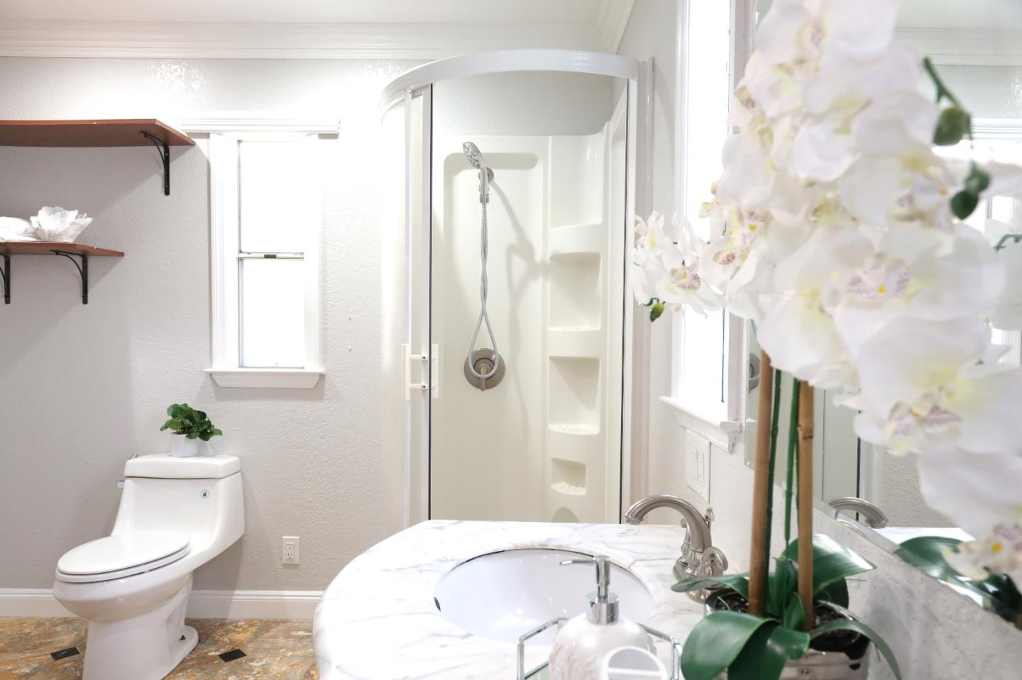 5450 Monterey Road, Unit 168 San Jose, CA 95111 - Photo 18 of 65 a bathroom with a sink toilet and shower