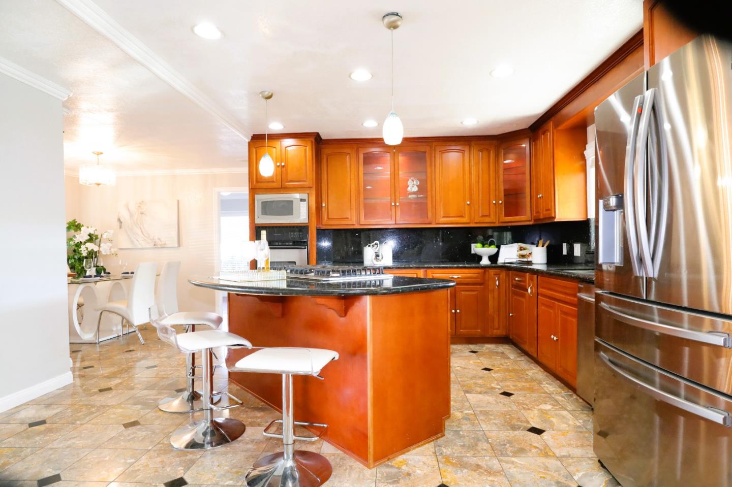 5450 Monterey Road, Unit 168 San Jose, CA 95111 - Photo 25 of 65 a kitchen with stainless steel appliances kitchen island granite countertop a sink and cabinets