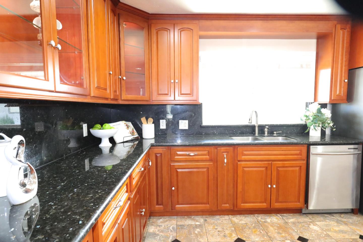5450 Monterey Road, Unit 168 San Jose, CA 95111 - Photo 27 of 65 a kitchen with granite countertop sink and cabinets