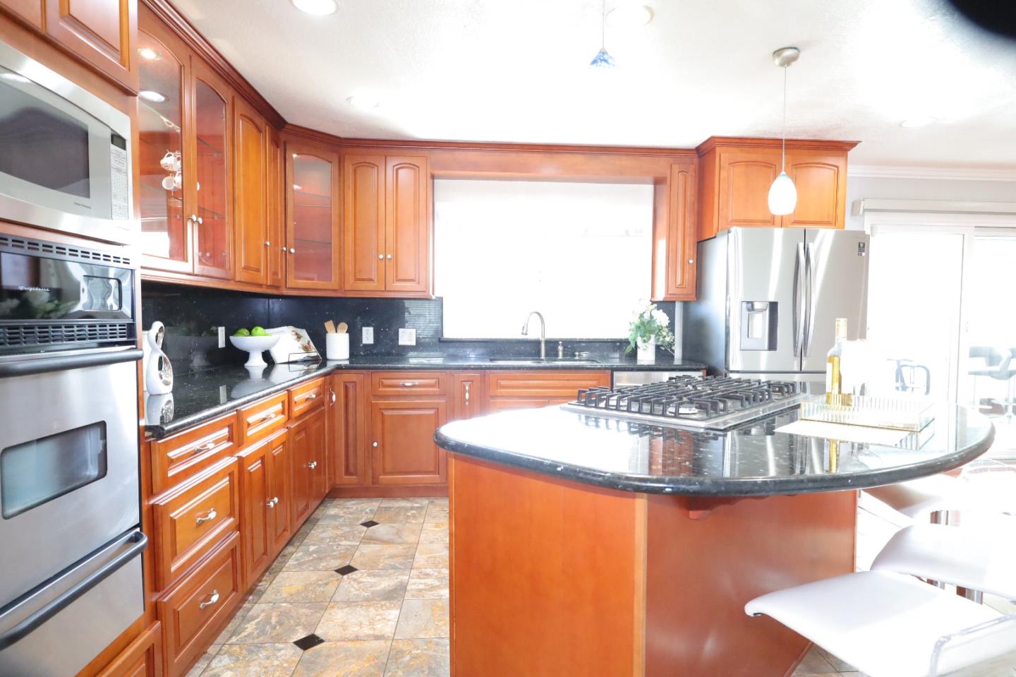 5450 Monterey Road, Unit 168 San Jose, CA 95111 - Photo 28 of 65 a kitchen with stainless steel appliances granite countertop a sink and a white cabinets