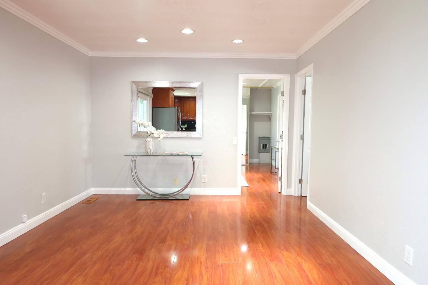 5450 Monterey Road, Unit 168 San Jose, CA 95111 - Photo 31 of 65 a view of an empty room with wooden floor and a window