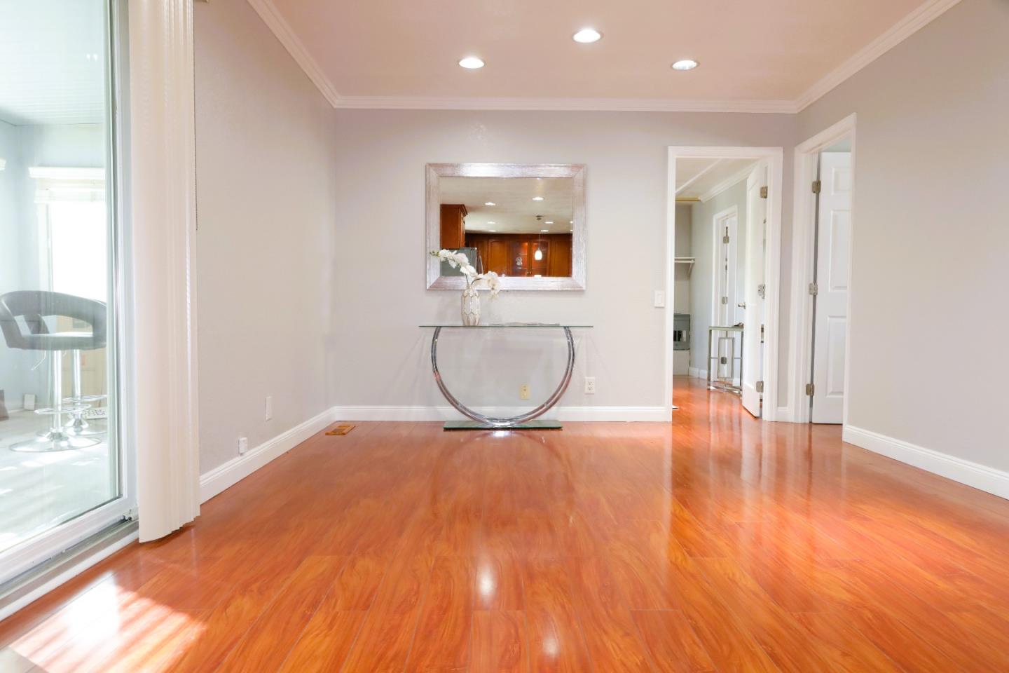 5450 Monterey Road, Unit 168 San Jose, CA 95111 - Photo 33 of 65 a view of an empty room with wooden floor and a window