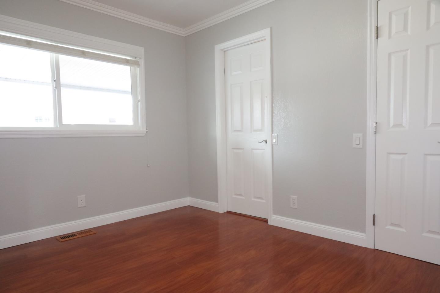 5450 Monterey Road, Unit 168 San Jose, CA 95111 - Photo 56 of 65 an empty room with wooden floor and windows