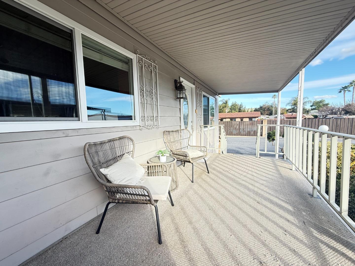5450 Monterey Road, Unit 168 San Jose, CA 95111 - Photo 59 of 65 a view of a patio with table and chairs with wooden floor and fence