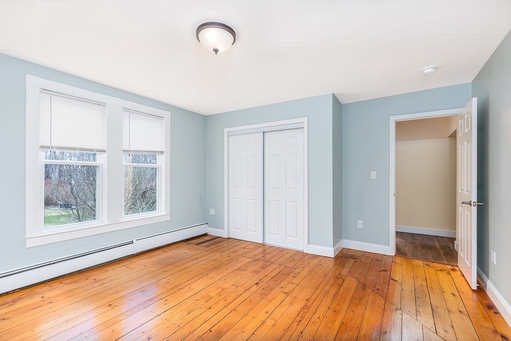 363 Concord Road Billerica, MA 01821 - Photo 17 of 42 a view of empty room with wooden floor and fan