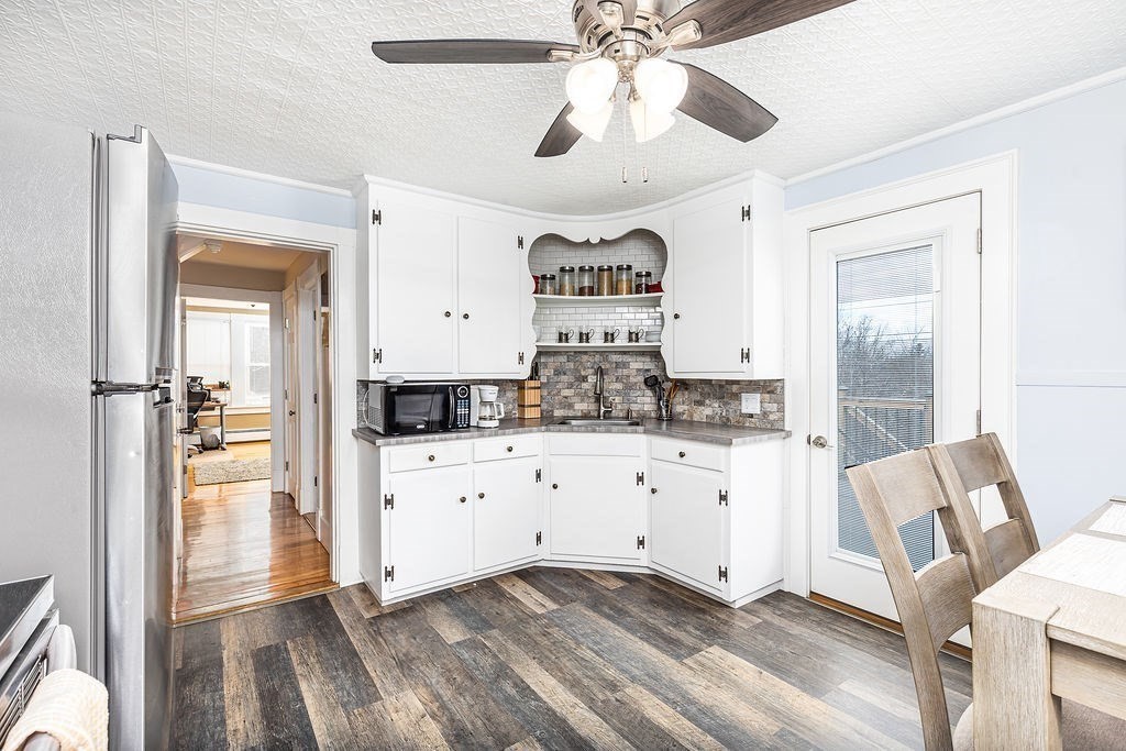 363 Concord Road Billerica, MA 01821 - Photo 20 of 42 a kitchen with stainless steel appliances a refrigerator and cabinets