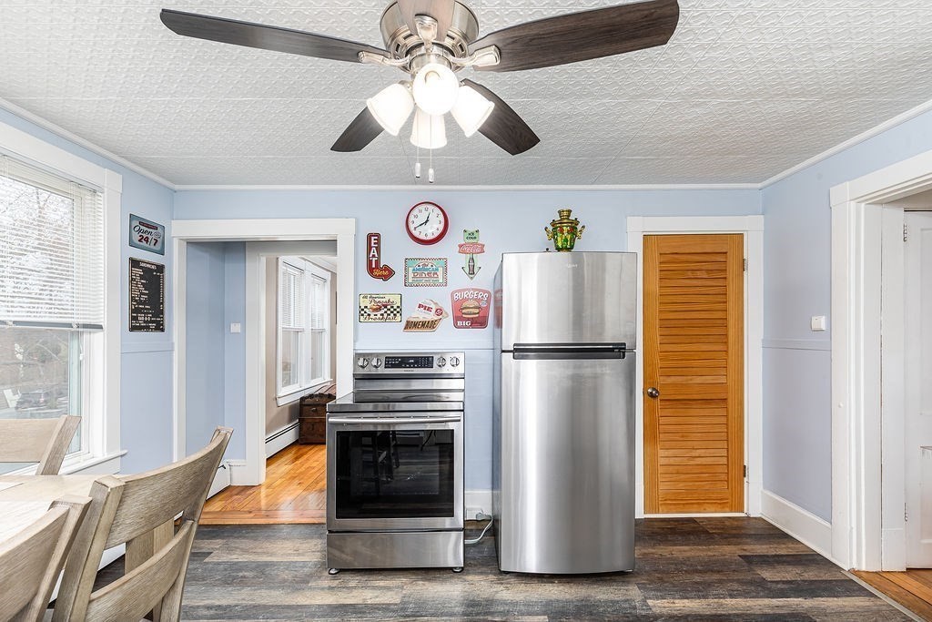 363 Concord Road Billerica, MA 01821 - Photo 21 of 42 a white refrigerator freezer and a stove sitting inside of a room