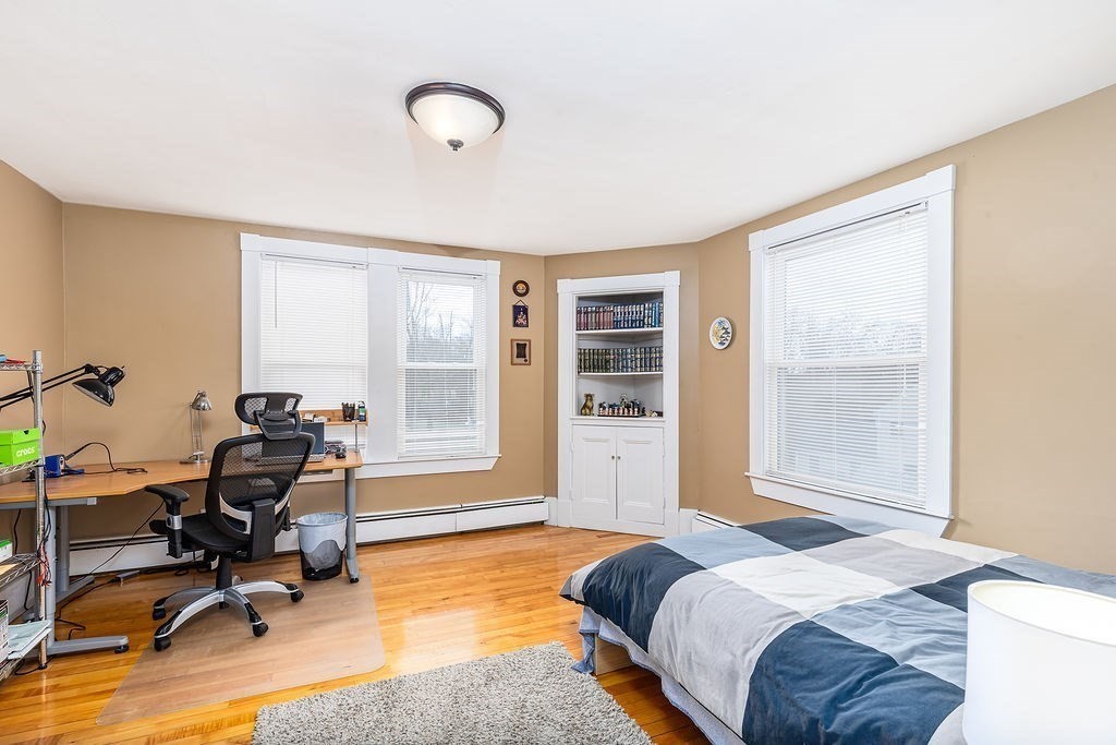 363 Concord Road Billerica, MA 01821 - Photo 27 of 42 a bedroom with a workspace