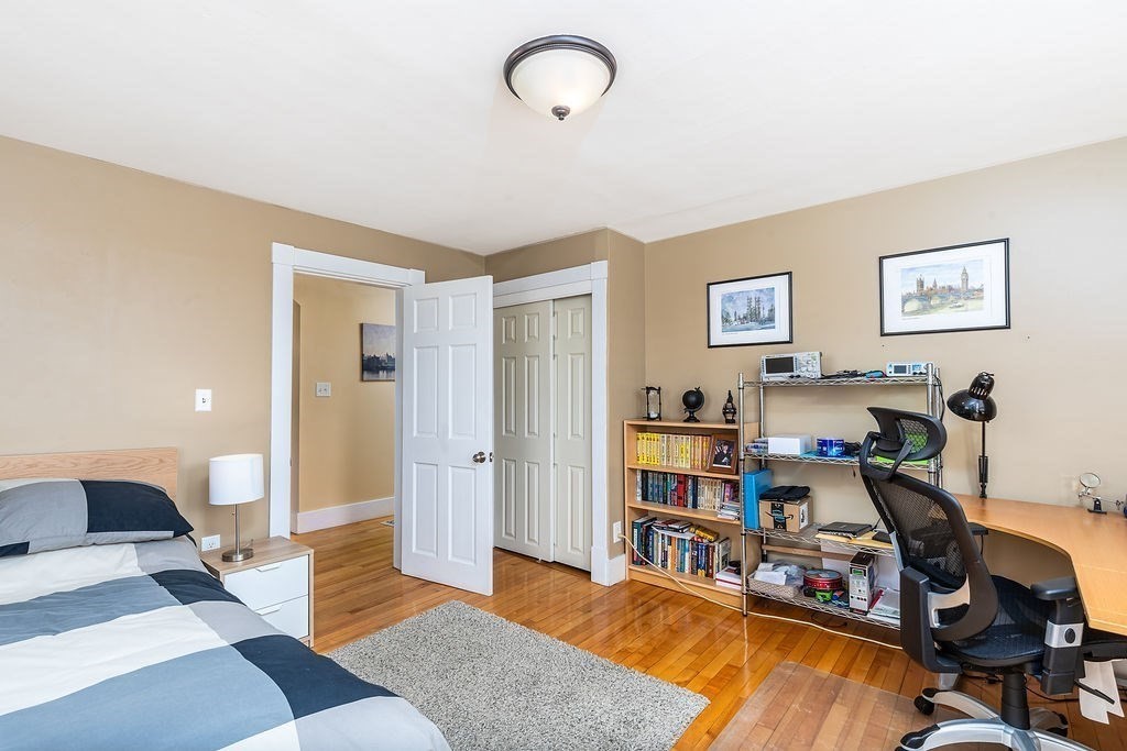 363 Concord Road Billerica, MA 01821 - Photo 28 of 42 a bedroom with furniture and a wooden floor