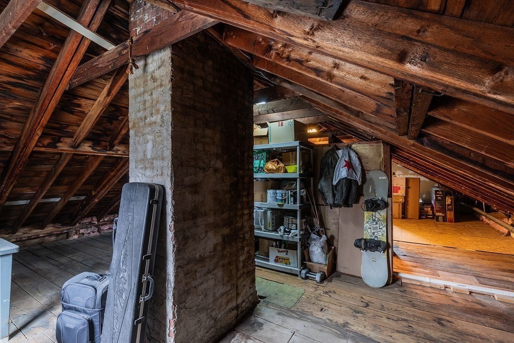 363 Concord Road Billerica, MA 01821 - Photo 32 of 42 a view of water heater room with wooden floor