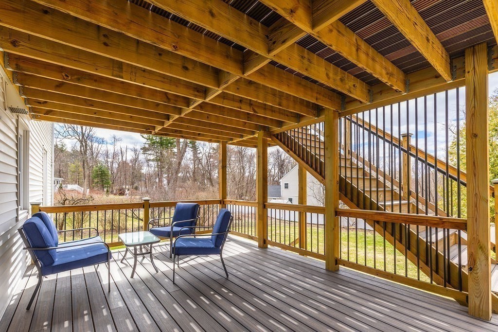 363 Concord Road Billerica, MA 01821 - Photo 40 of 42 a view of a balcony with chairs and wooden floor