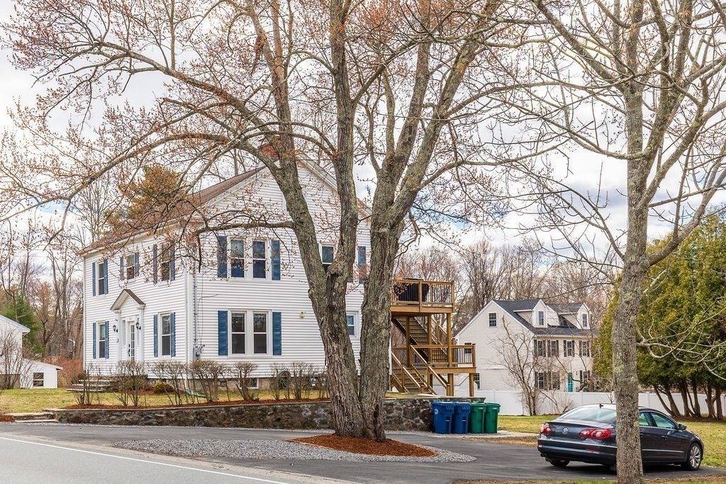 363 Concord Road Billerica, MA 01821 - Photo 41 of 42 a front view of a building with lot of cars and trees