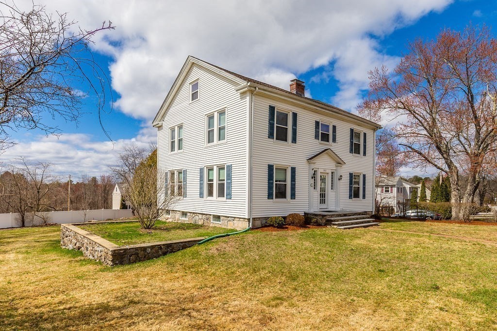 363 Concord Road Billerica, MA 01821 - Photo 42 of 42 a front view of residential houses with yard and trees