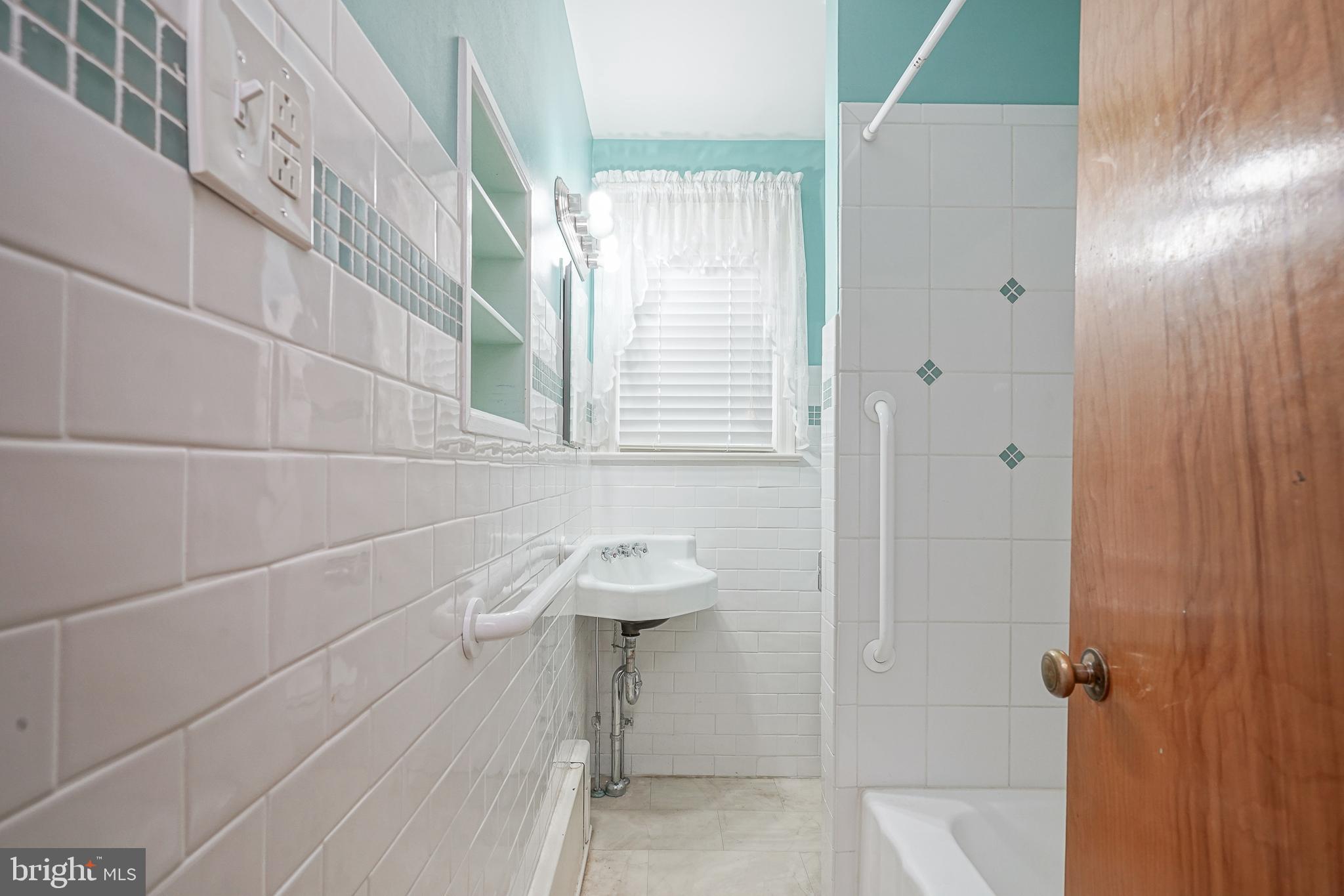 227 Harmony Road Gibbstown, NJ 08027 - Photo 18 of 29 a bathroom with a sink and shower