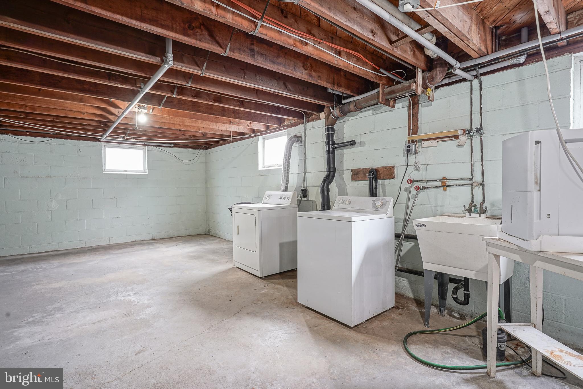227 Harmony Road Gibbstown, NJ 08027 - Photo 24 of 29 a utility room with dryer and washer