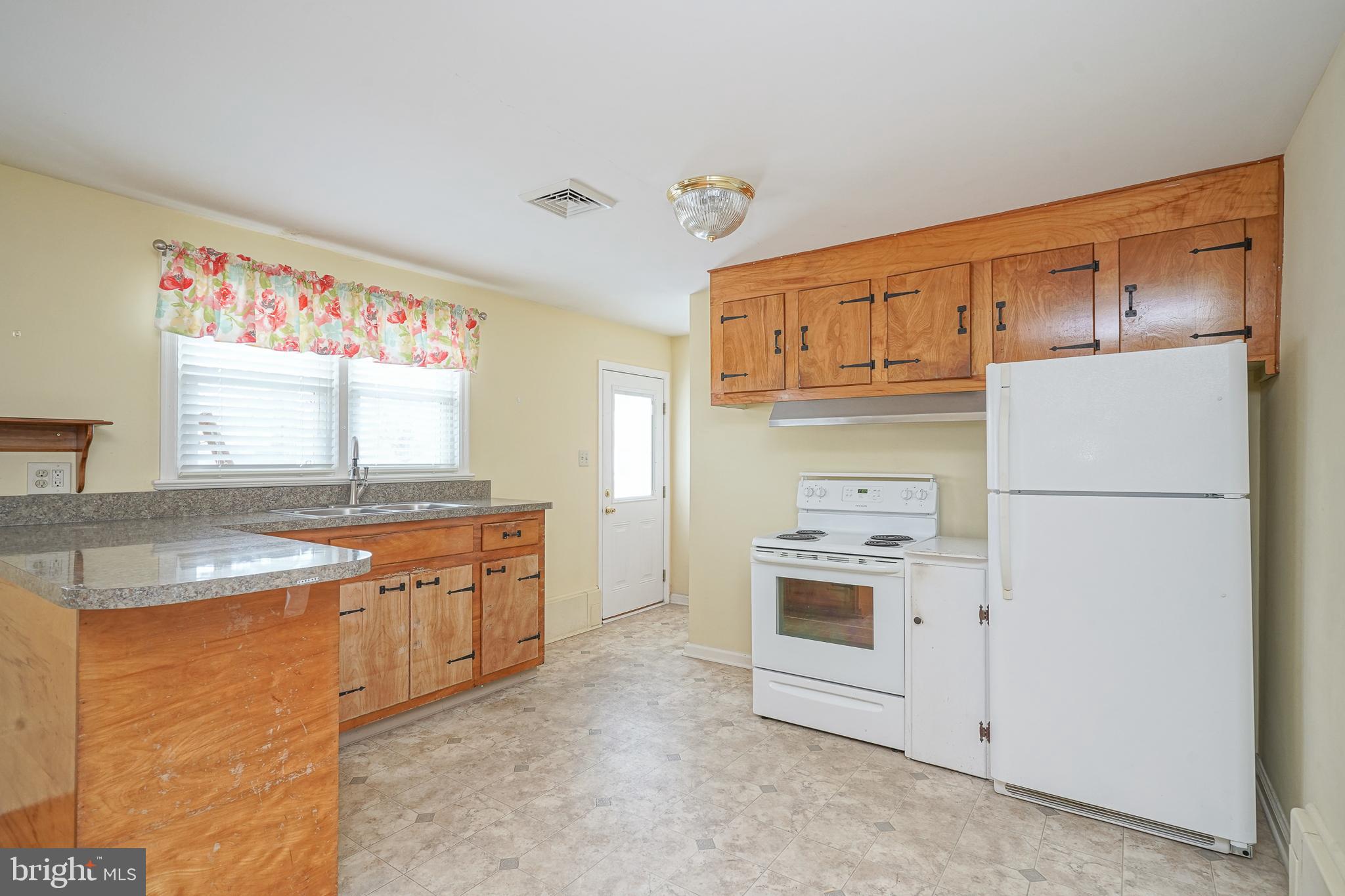 227 Harmony Road Gibbstown, NJ 08027 - Photo 6 of 29 a kitchen with stainless steel appliances granite countertop a refrigerator and a sink