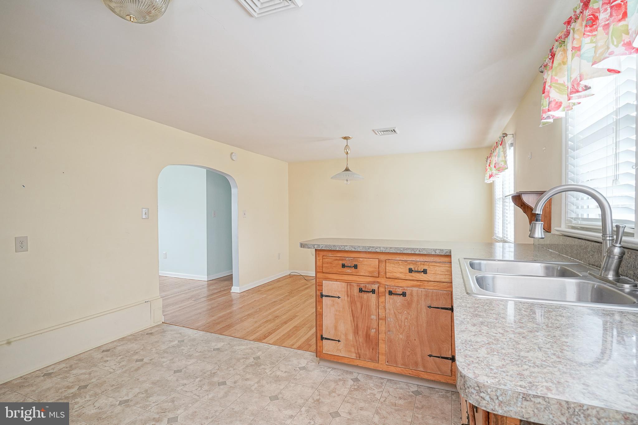 227 Harmony Road Gibbstown, NJ 08027 - Photo 8 of 29 a view of a kitchen with a sink and cabinets