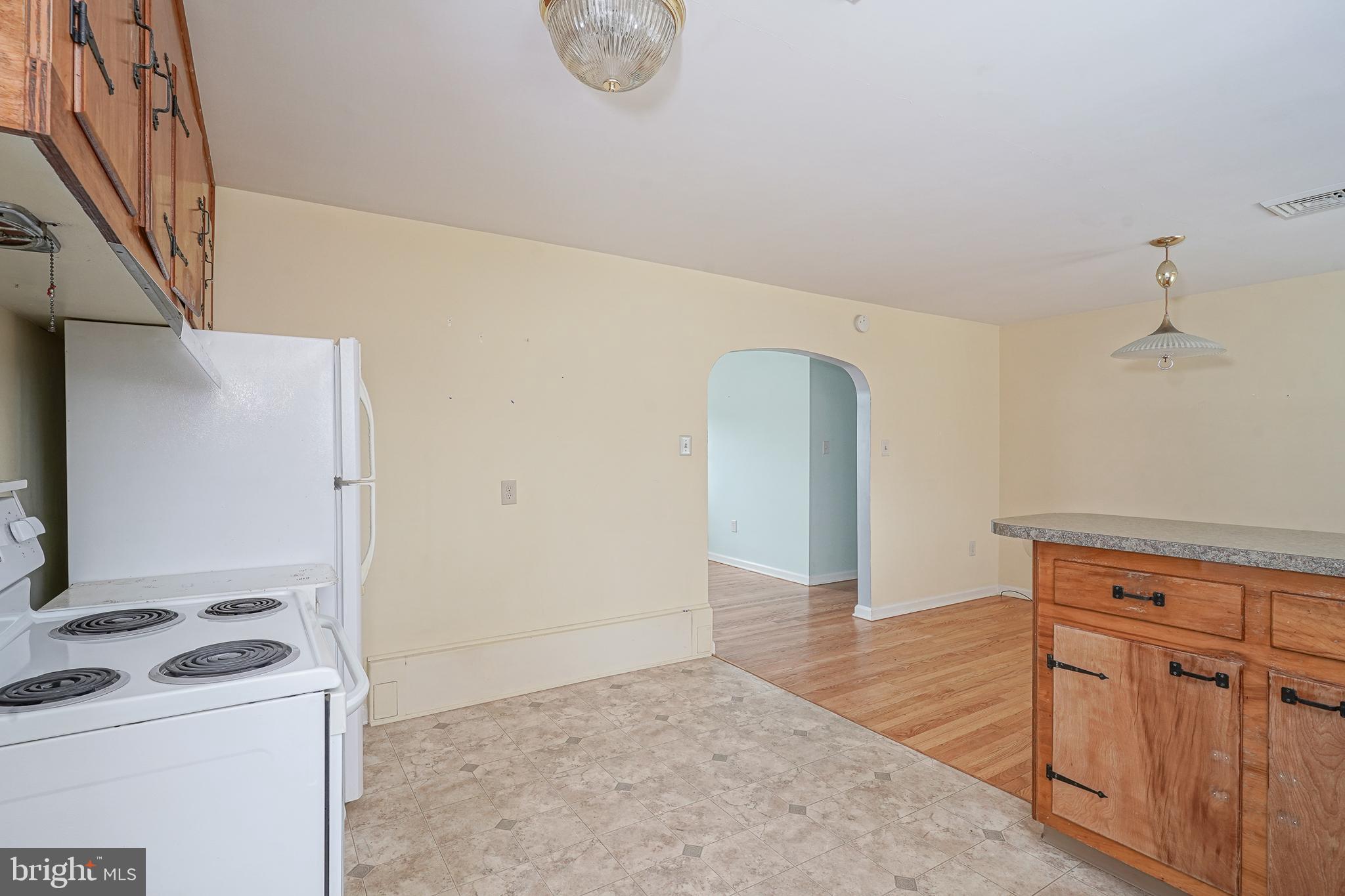 227 Harmony Road Gibbstown, NJ 08027 - Photo 9 of 29 a view of a kitchen with refrigerator and stove