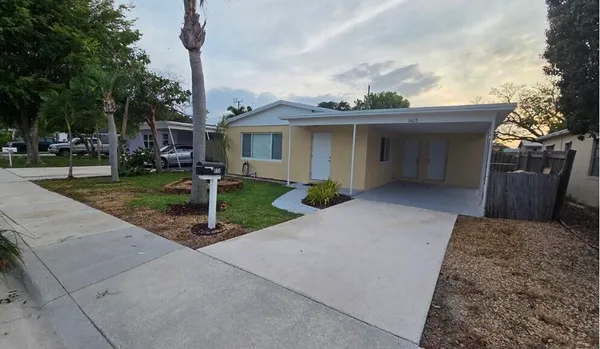 a view of a house with a sink and garden