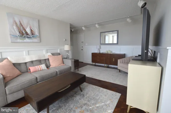 a living room with furniture and a couch