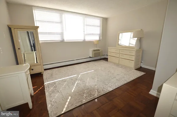 a view of a kitchen with wooden floor and staircase