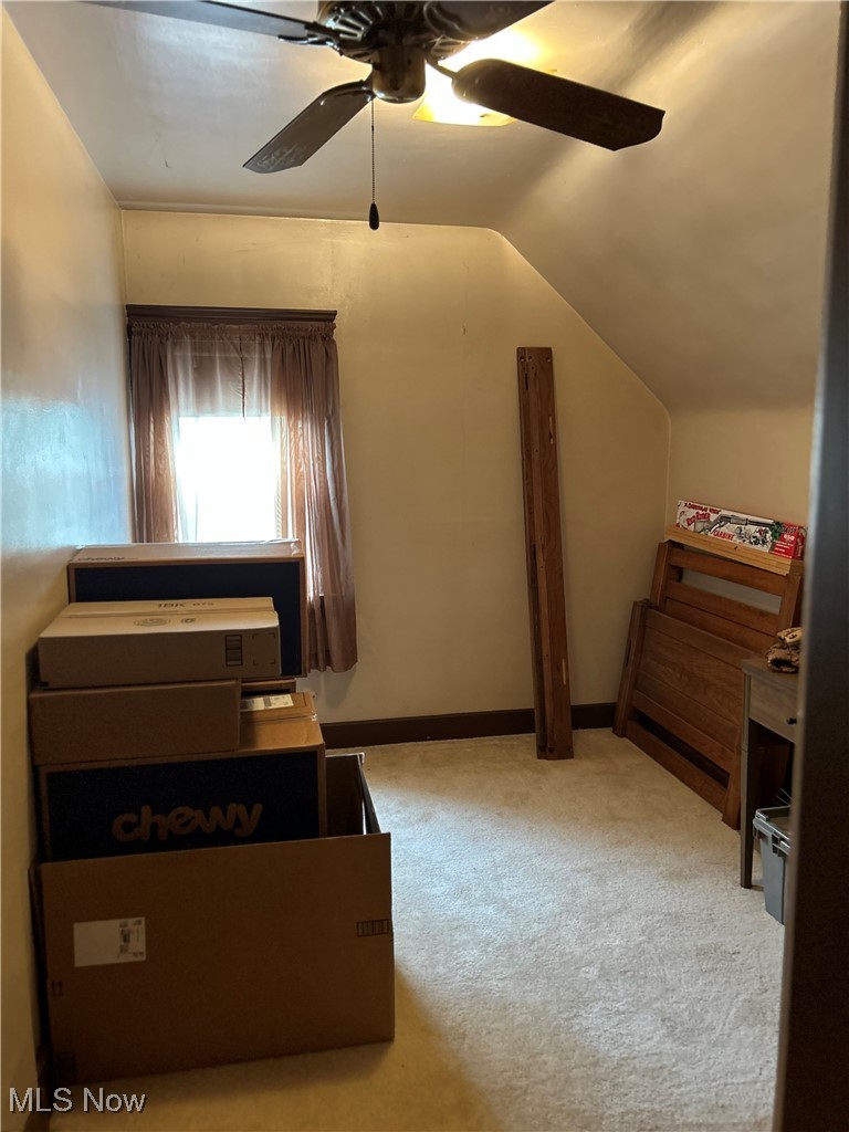 11406 Bellaire Road Cleveland, OH 44111 - Photo 15 of 28 Carpeted bedroom with vaulted ceiling and a ceiling fan